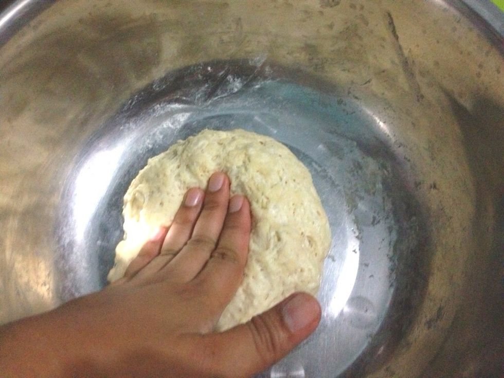 After 45 mnts, press the dough to release the air and divide the dough into two equal portion