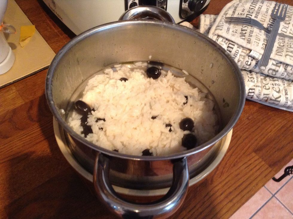 After 5 mins of simmering drain the rive and add the olives