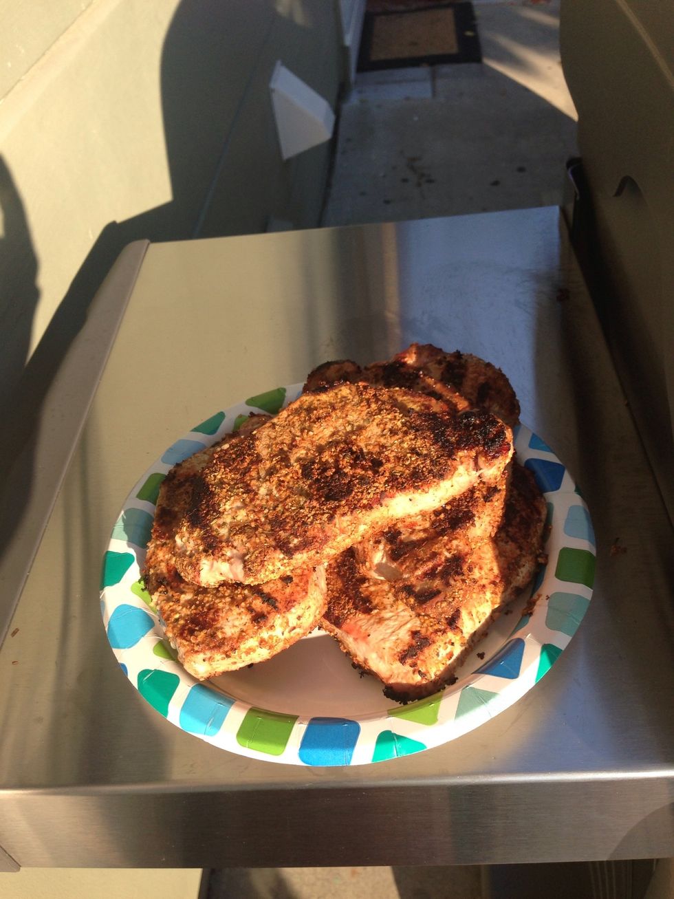 After 5 mins, take the pork off the grill and let it sit for 3 mins.