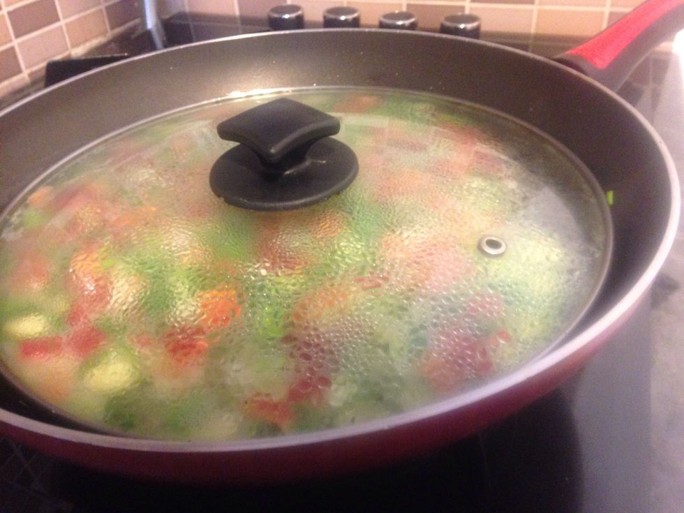 After 5 minutes cover with a lid so that the veg can soften...