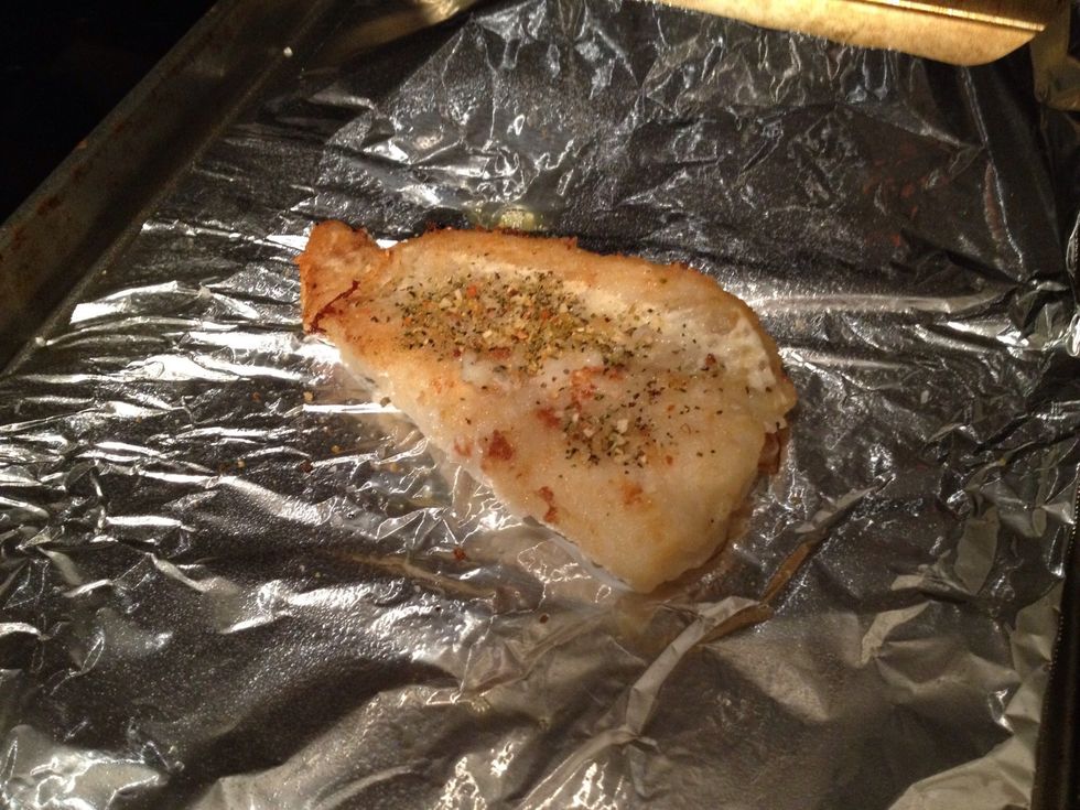 After 5 minutes of cooking, the fish should be browned on the bottom. Place this side up on the oven tray and add more salt/pepper.