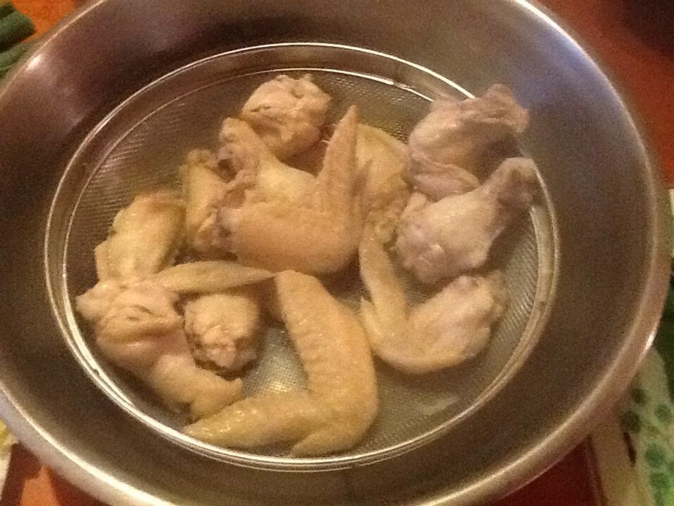 After 5mins take the chicken out and put them in a colander