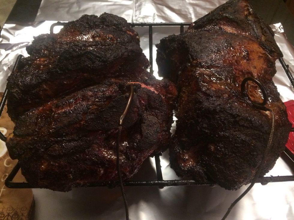 After 6 hours on the grill the butts look like this. A very dark bark has formed and the internal temp is around 160 degrees