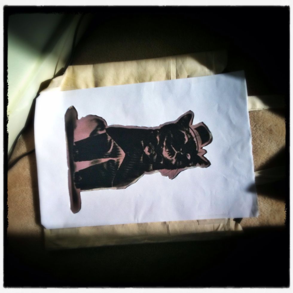 After a couple minutes you can place the stencil over the negative to create a border effect by masking the lightly brushed area around the image. Leave the mask in place for the rest of the exposure.