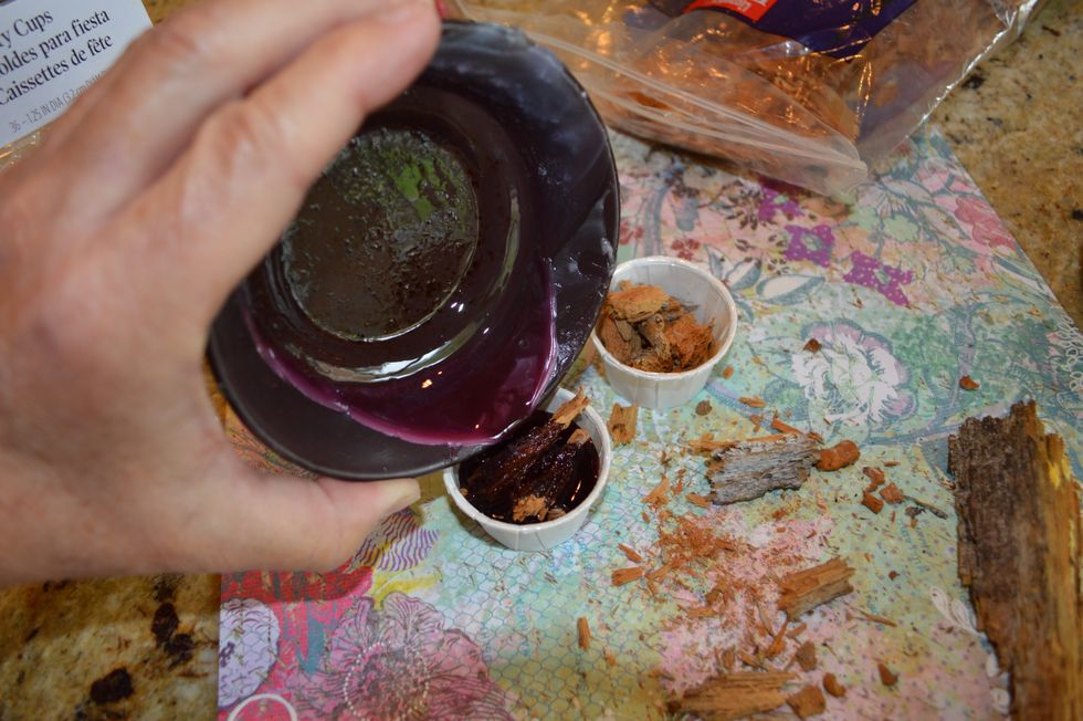 After a day or two, the melted scented wax in your warmer cup is exhausted. What to do with the old wax? Pour it on top of the crumbly old wood in the paper cup to make a dandy fire starter.