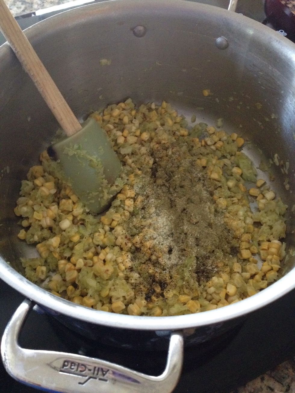 After a few minutes, I add all the spices. 2 tsp: thyme and garlic powder. 1 tsp: salt and garlic salt. And pepper to taste. Cook this for a minute or two