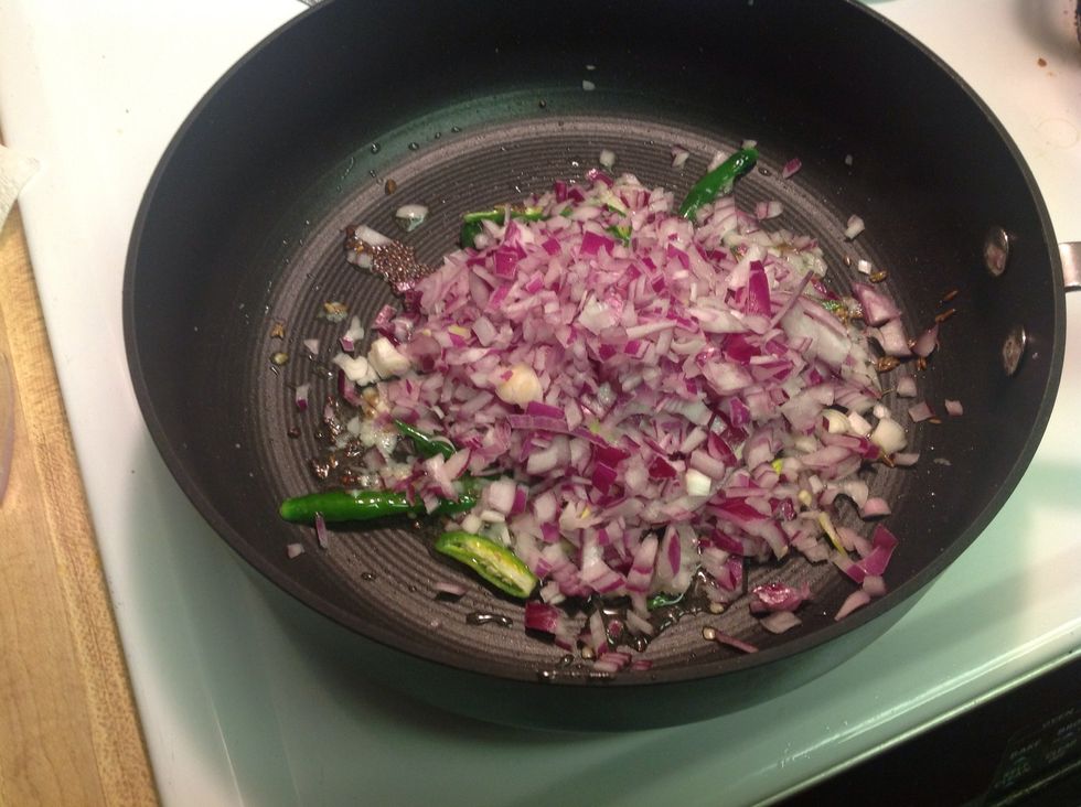 After a minute add in onions and saut\u00e9.