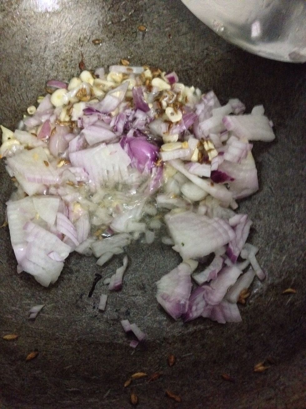 After a minute add one finely chopped onion