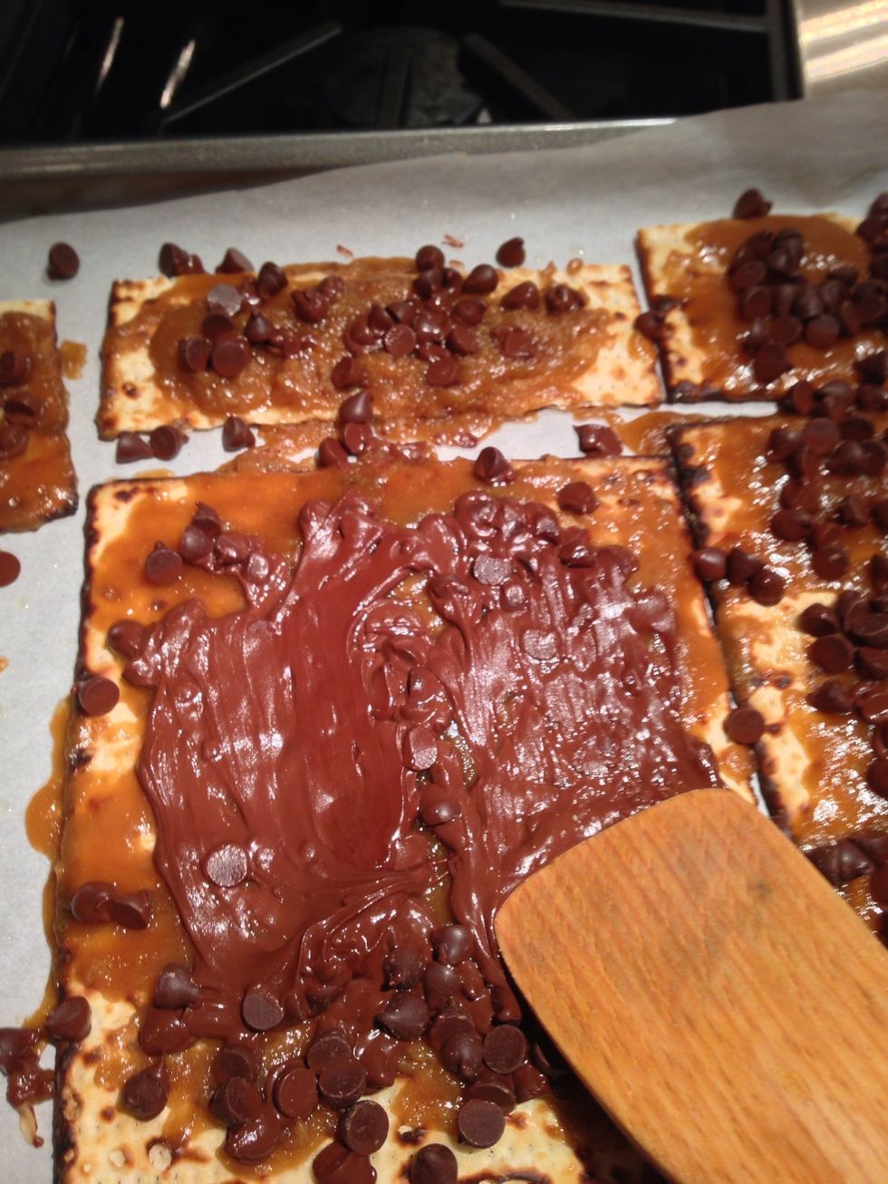 After a minute or so spread the chocolate all over the matzah. Try to cover as much as you can.