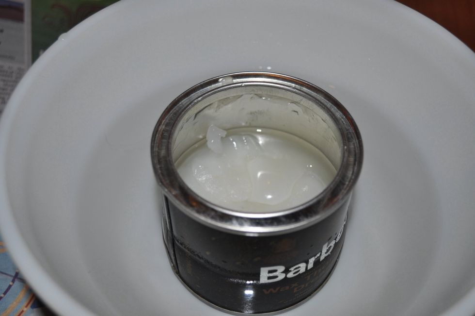 After a minute or two the wax will begin to melt. Note the liquid like consistency on the top and sides of the can.