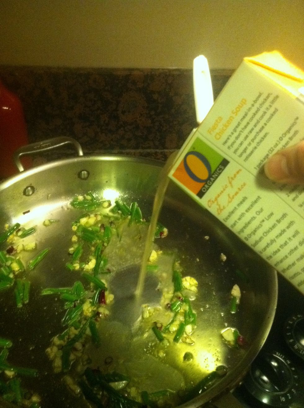 After a minute, pour in about half a cup of stock. If you prefer, use some reserved pasta water instead.