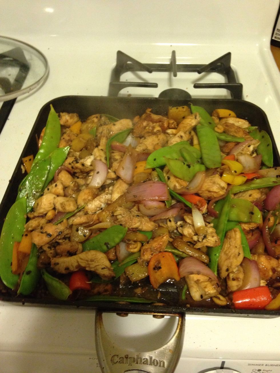 After a minute, str everything together and finish cooking for another minute or until the chicken is cooked.