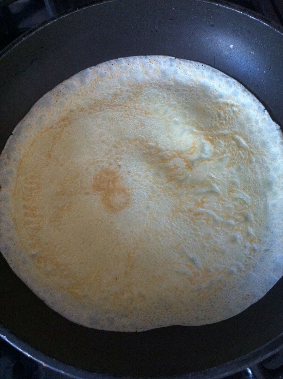 After about 1 min, flip your crepe over with your spatula. Cook on the other side for about 30 sec. On your 2nd and 3rd crepe, the pan will already be hot, so cook time is about 1 min on both sides.