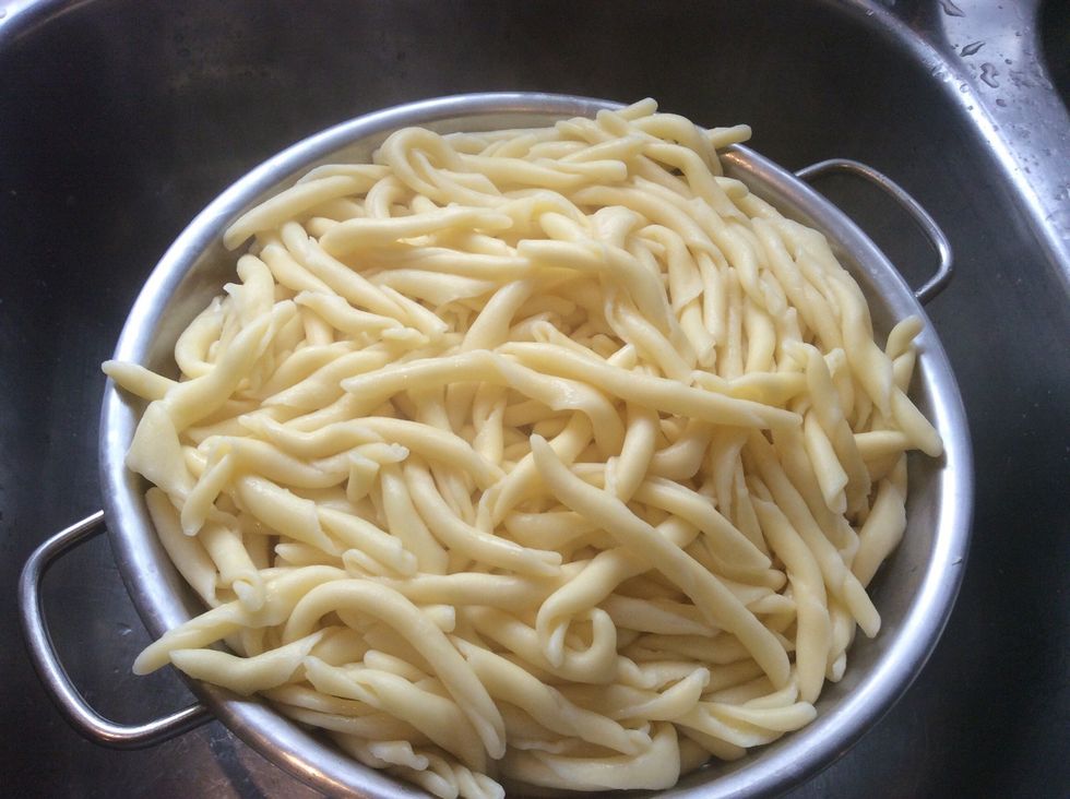 after about 10-12 minutes of cooking pasta, drain the water.