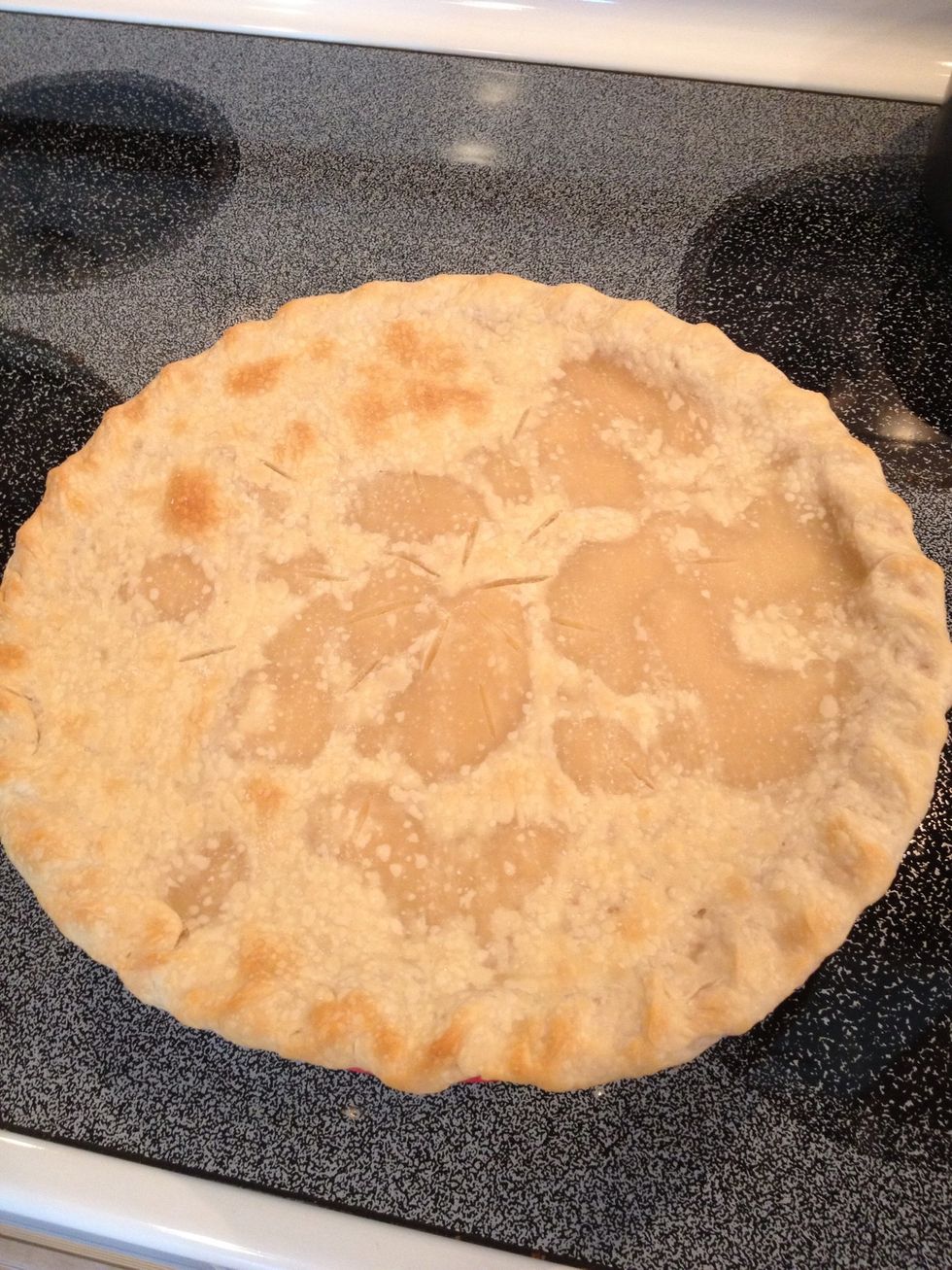After about 10-12 minutes, remove the pie from the oven.
