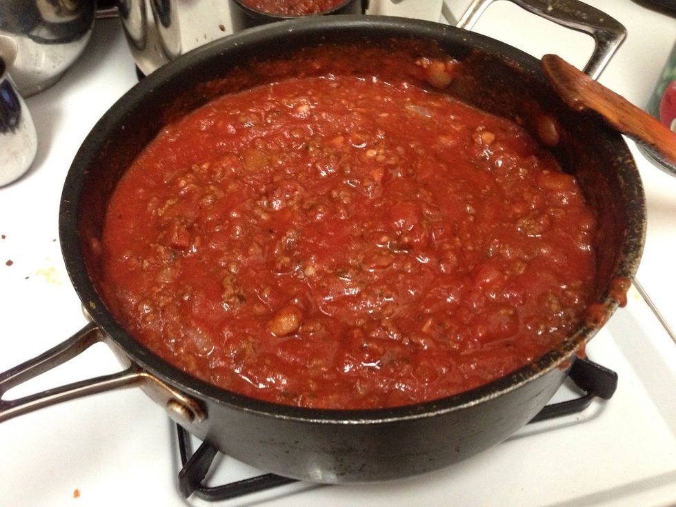 After about 2 minutes add the 2 jars of sauce and lower the heat to a simmer. Stir the sauce, cover it and let cook for about 30 minutes. Stir it every 10 minutes or so.