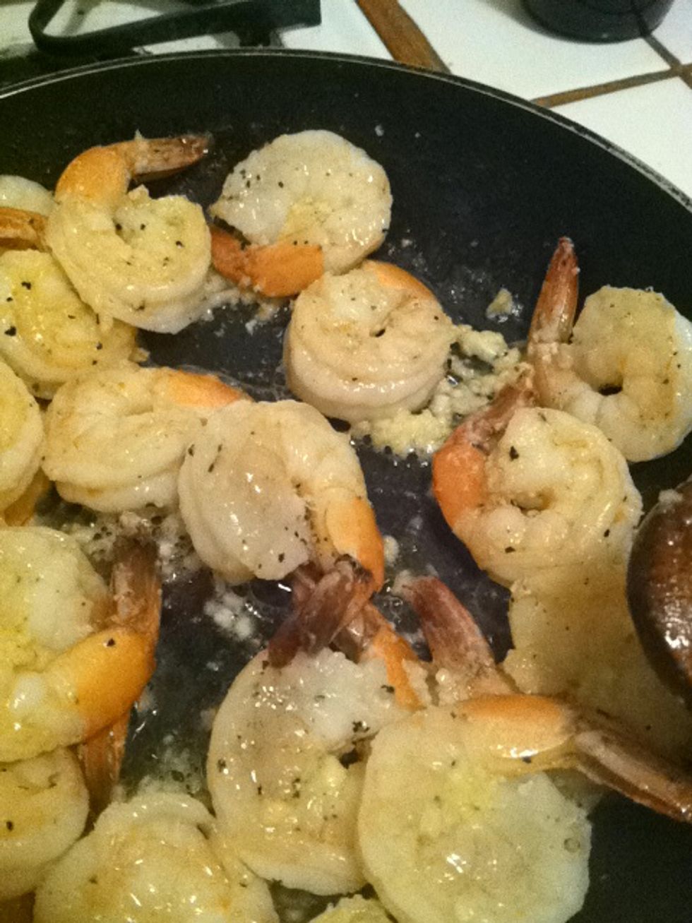 After about 2 minutes put the garlic in and stir vigorously until done.