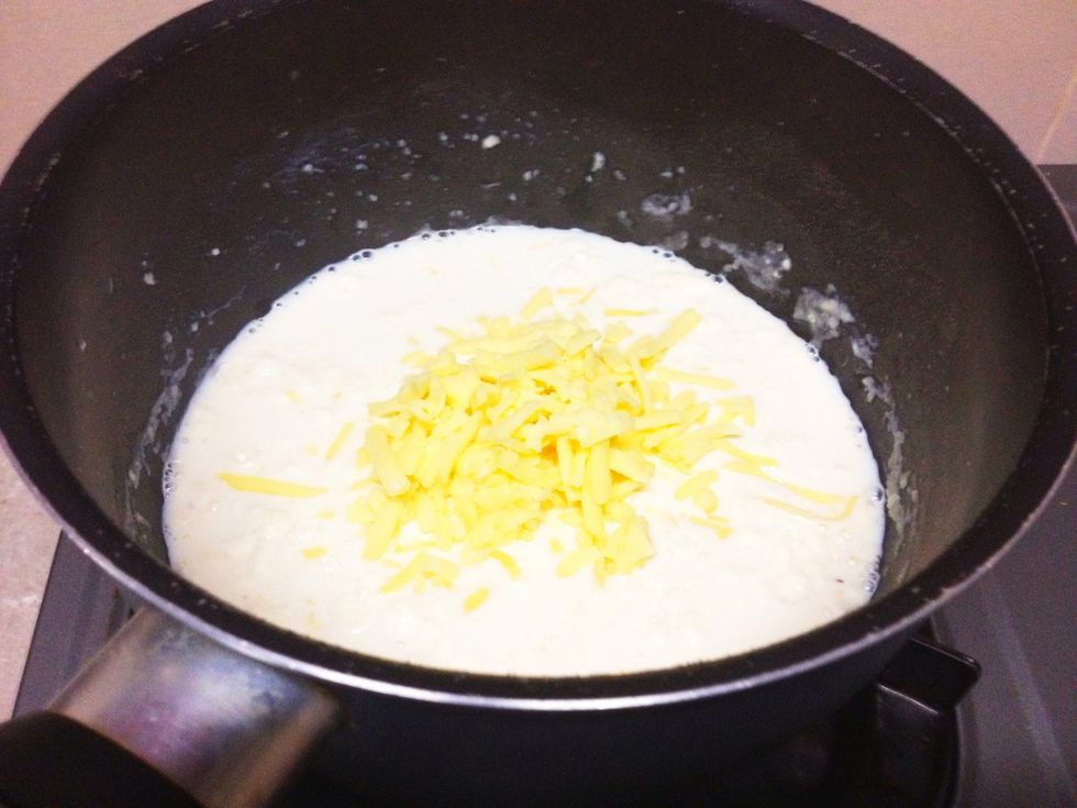 After about 30 seconds, (you wanna cook out the flour taste) add in your cheese.