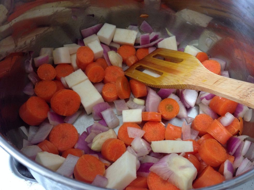 After about 4 minutes of saut\u00e9ing, add carrots and because I had some, I added some celery root. You can also add diced celery at this point, if you'd like.