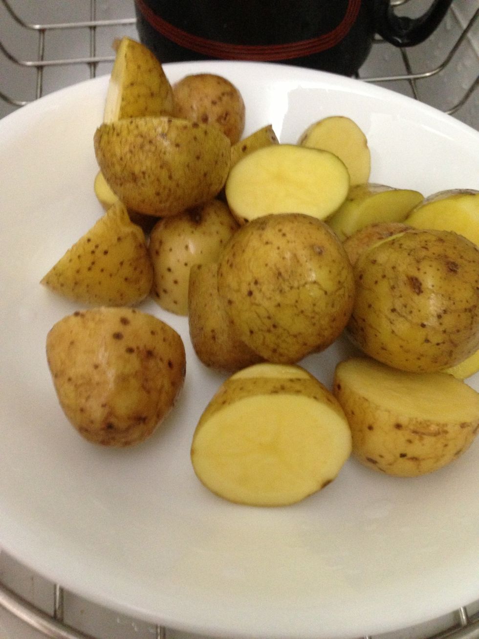 After about 45 mins, cut up potatoes. Mix it with olive oil and put into the casserole