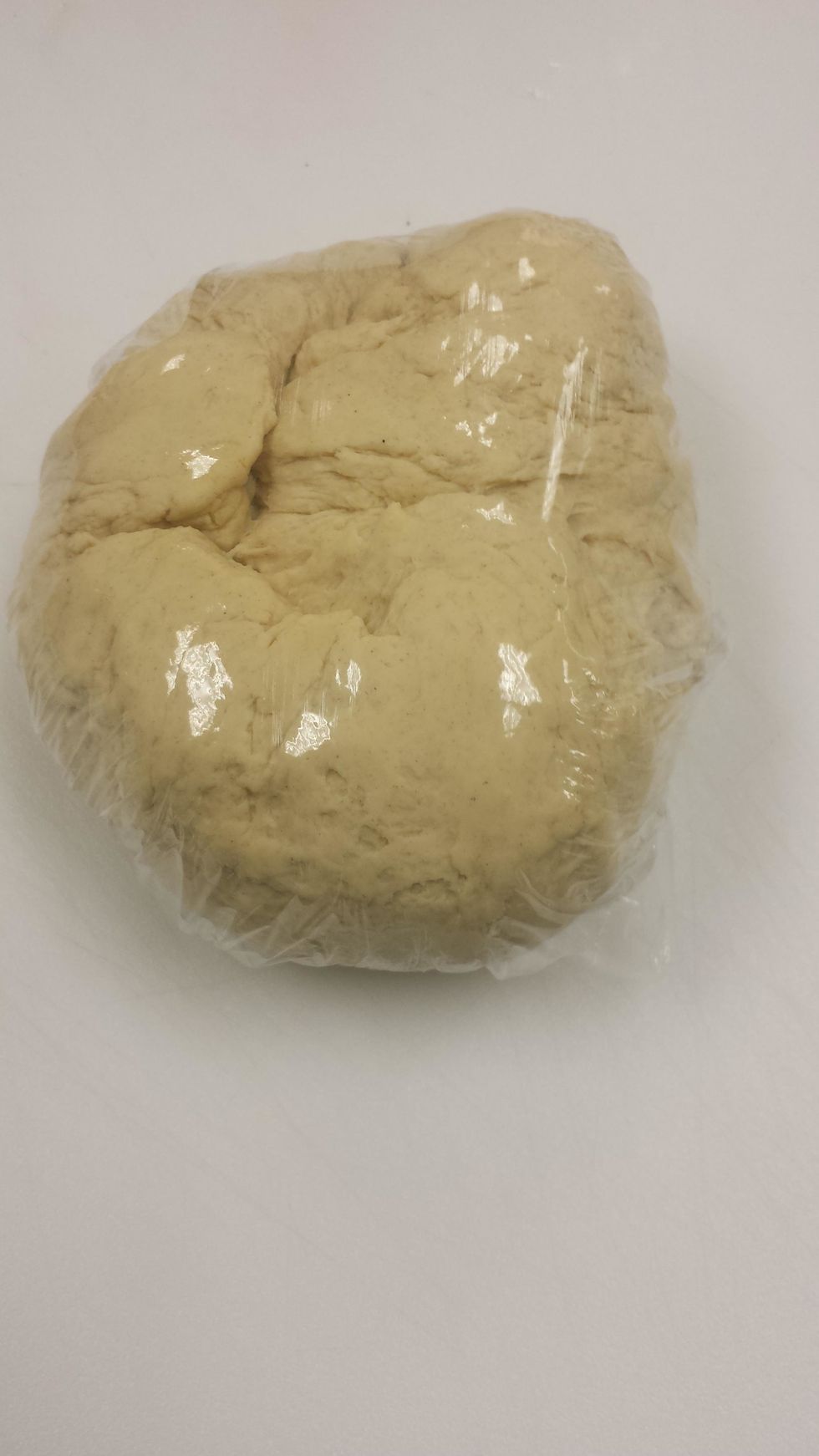 After about 5 minutes of mixing after a cohesive ball of dough has formed. Let rest for 30 minutes. Knead for 5 more minutes, wrap and rest in the fridge for 1 hour.