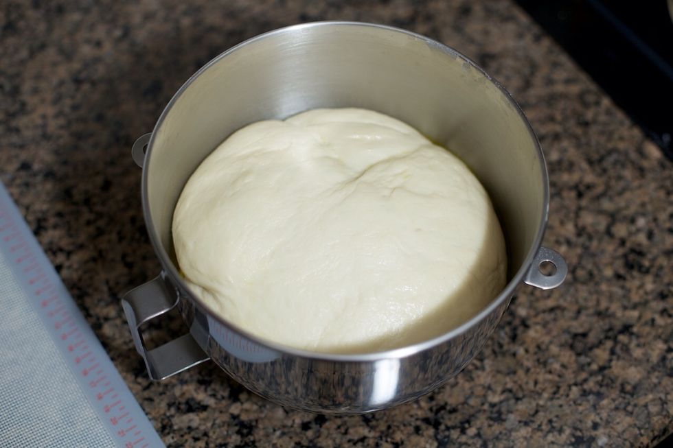 After about an hour, the dough should have doubled in volume.  As tempting as it may be, don't punch it down.  It'll be easier to roll that way.
