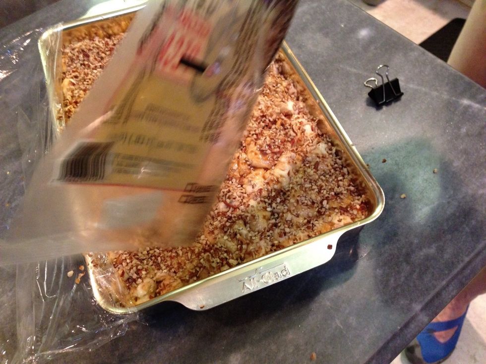 After about twenty minutes, sprinkle the top with the chopped pecans if you are using them. Notice the sugar/pudding syrup has just about all soaked down to the bottom.