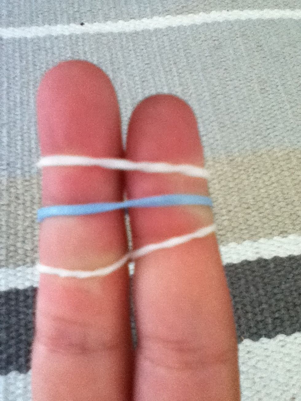 After add 2 loom bands normally. Remember do not create the figure of 8 ever again unless making another loom bracelet