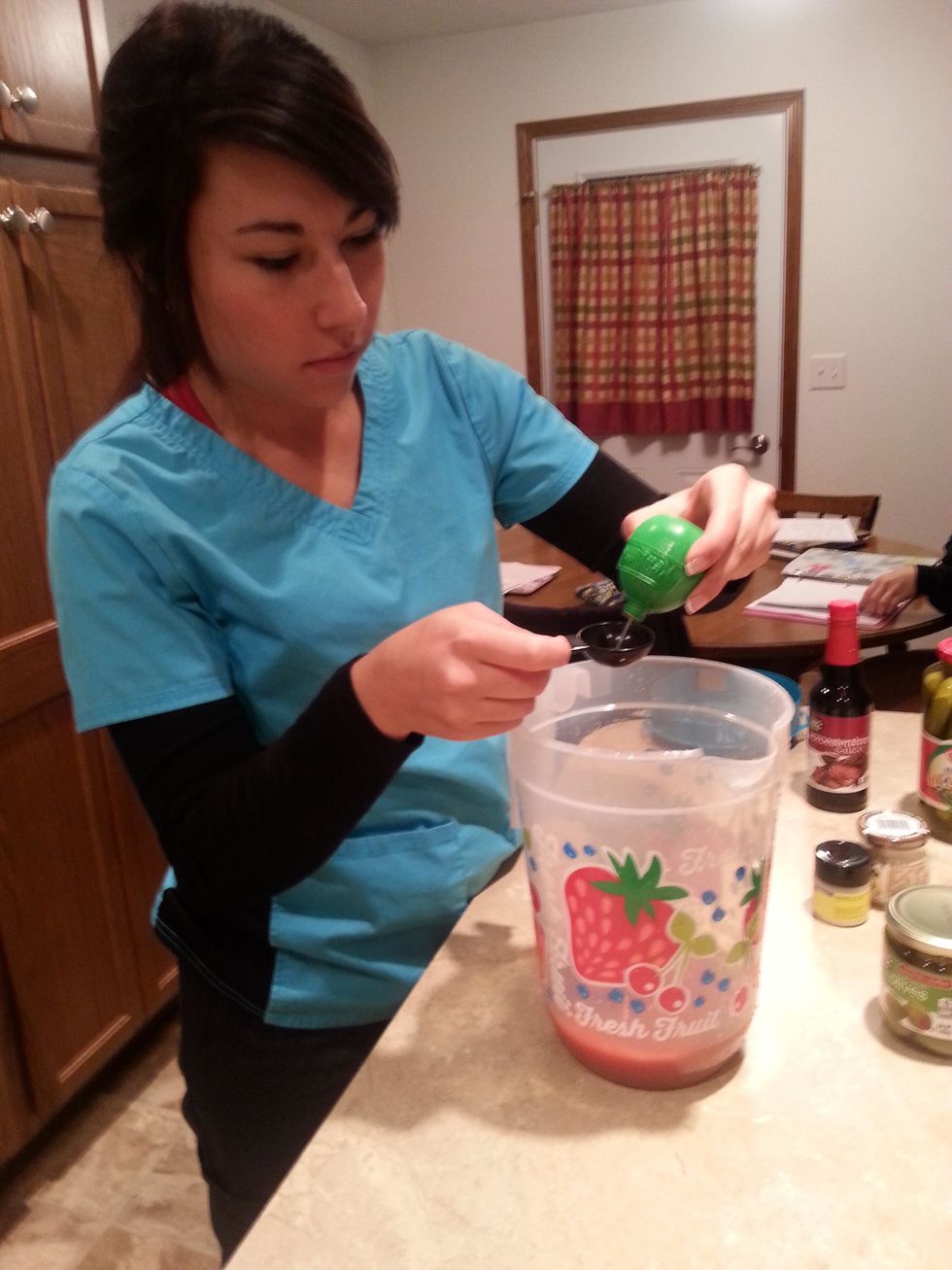After adding the tomato juice to the pitcher, add the 3 tablespoons of lime juice.