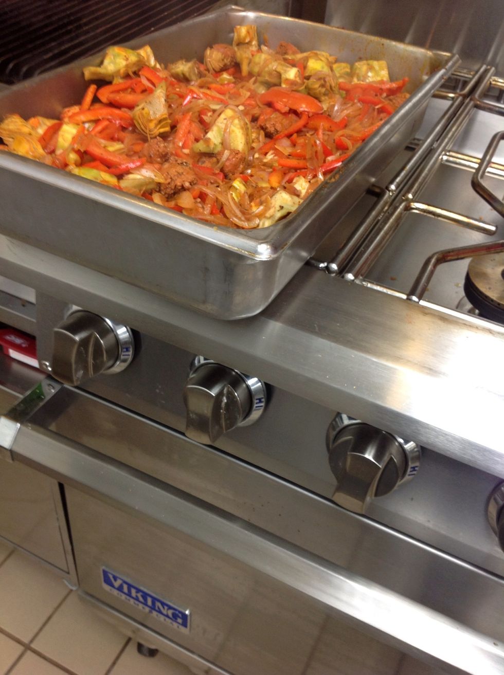 After adding tomatoes wine and stock bring to a boil and put into a hotel pan