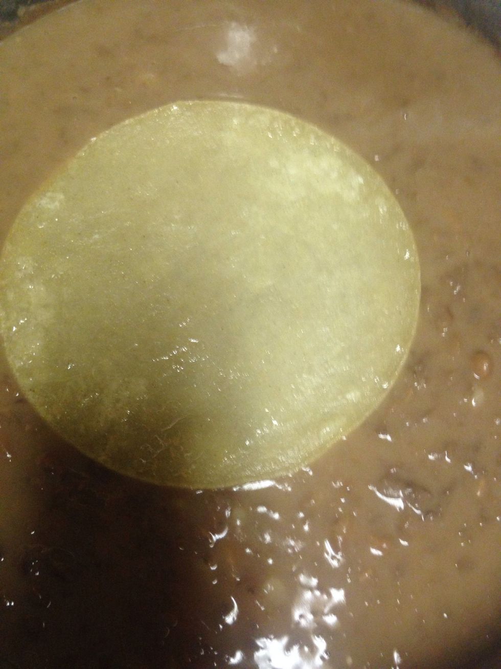 After all my tortillas are done I place one by one in my bean pan and just let them soak for a bit