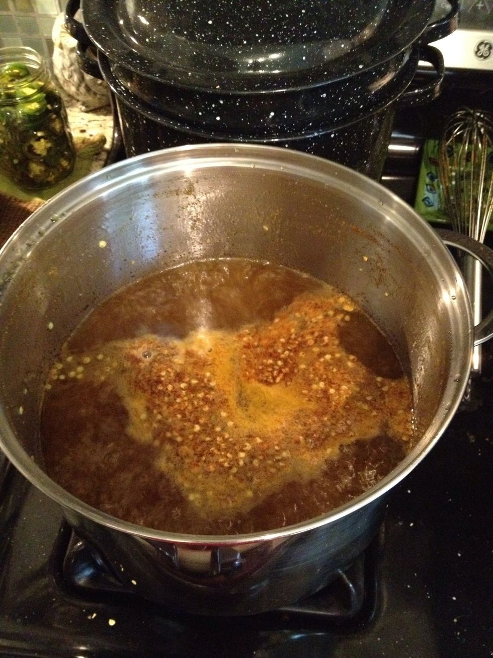 After all peppers have been removed, turn up the heat under the pot and bring to a full rolling boil. Boil hard for 6 minutes.