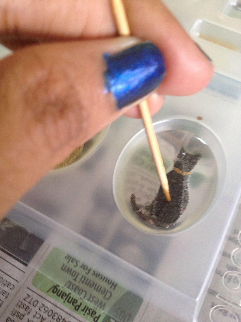 After an hour, proceed with placing the deco. Use a toothpick to position your creations. Wait another hour to add the background.