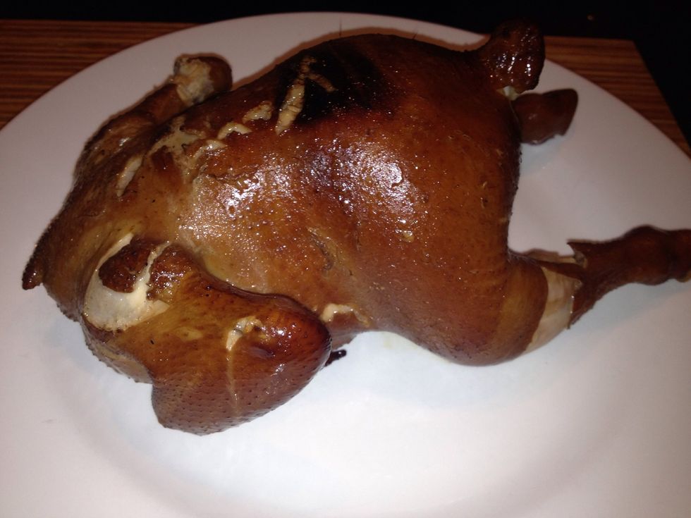 After an hour use a Knife to poke a hole in the breast if liquid coming out is not red it's cooked