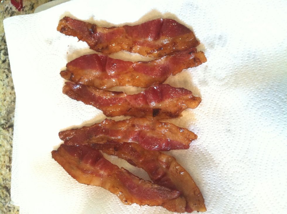 After another 20 minutes of cook time the bacon is ready. Place the strips onto a plate covered in paper towels to soak what some might call "excessive" flavor