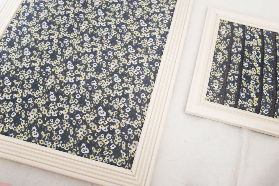 After applying a second coat of paint to your frame and letting it dry, fit the backing back in, and you're done. (I let my daughter help with the little one, which might be obvious! She loves it.)