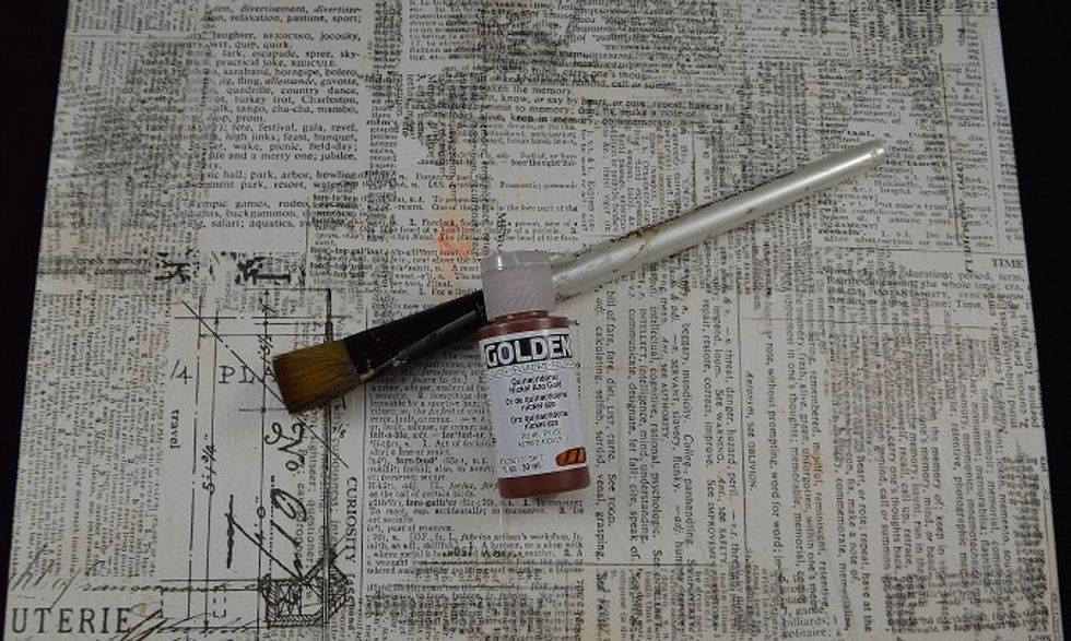 After applying the tissue wrap in a random fashion brush on a base coat of Golden's Quinacridone Nickel Azo Gold fluid acrylic.