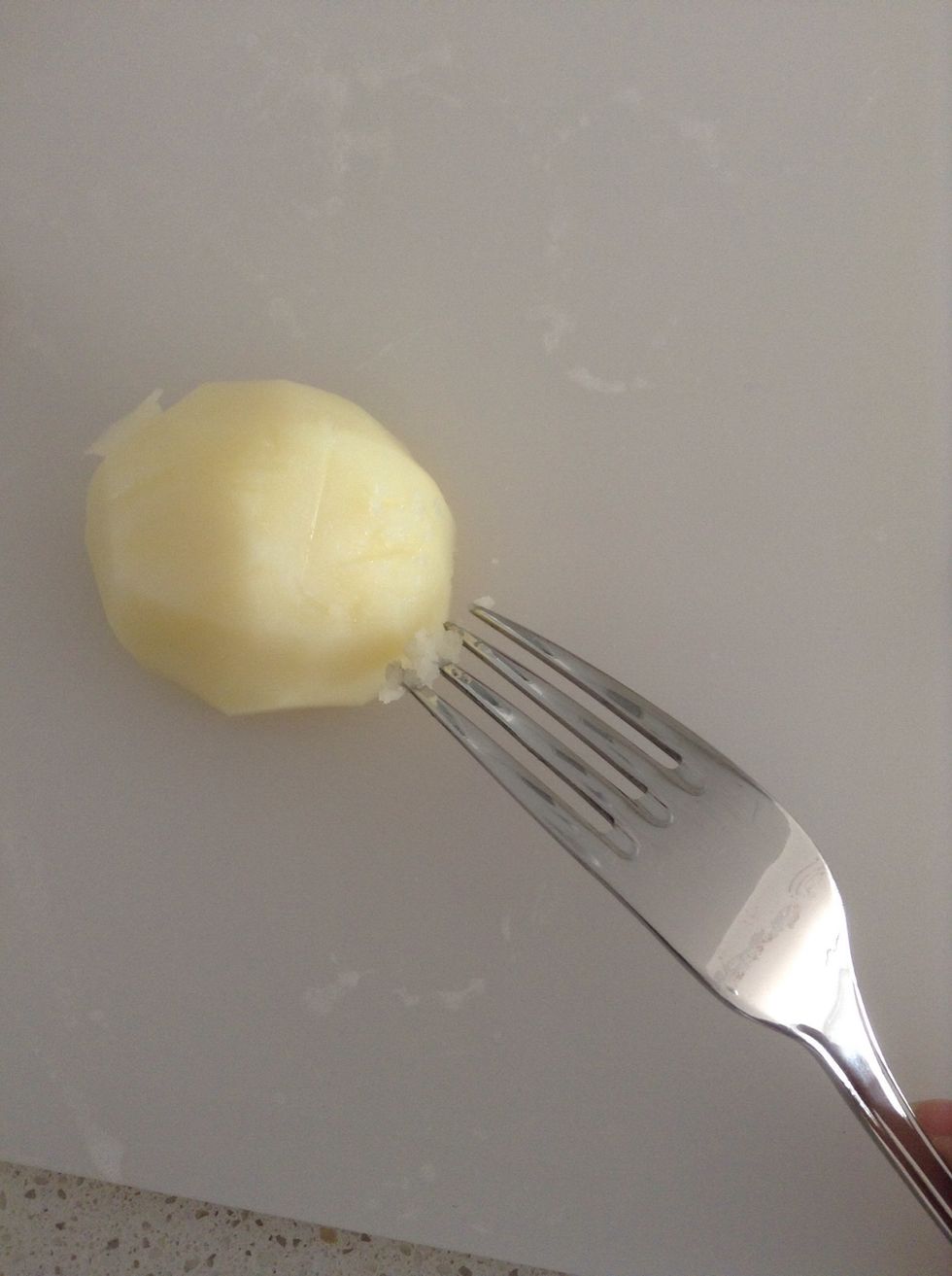 After around 10-15 mins check on the potatoes, lightly run a fork down the potato and if it's soft and fluffy on the outside they're ready.