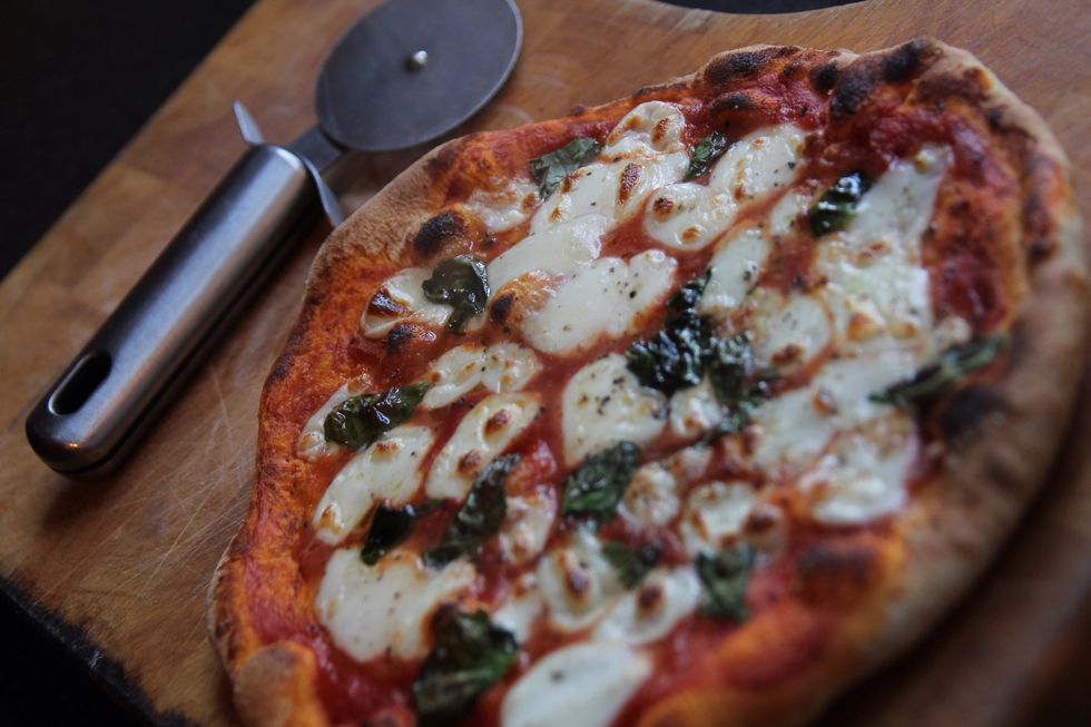 After around 90-120 seconds your pizza should be cooked. Put onto a board or plate to cool for a couple of minutes before cutting up and devouring! Then sit back and laugh at people who buy pizza!