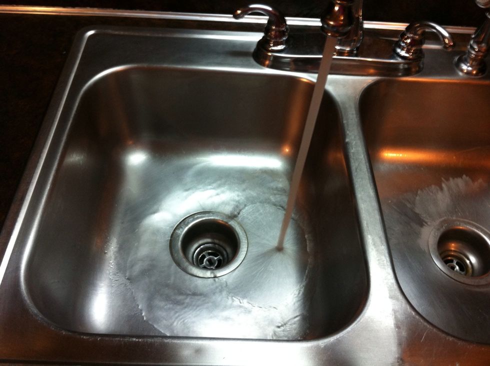 After at least 5 minutes, run a minute of hot water to clear the drain of any gunk the foam scrubbed off.