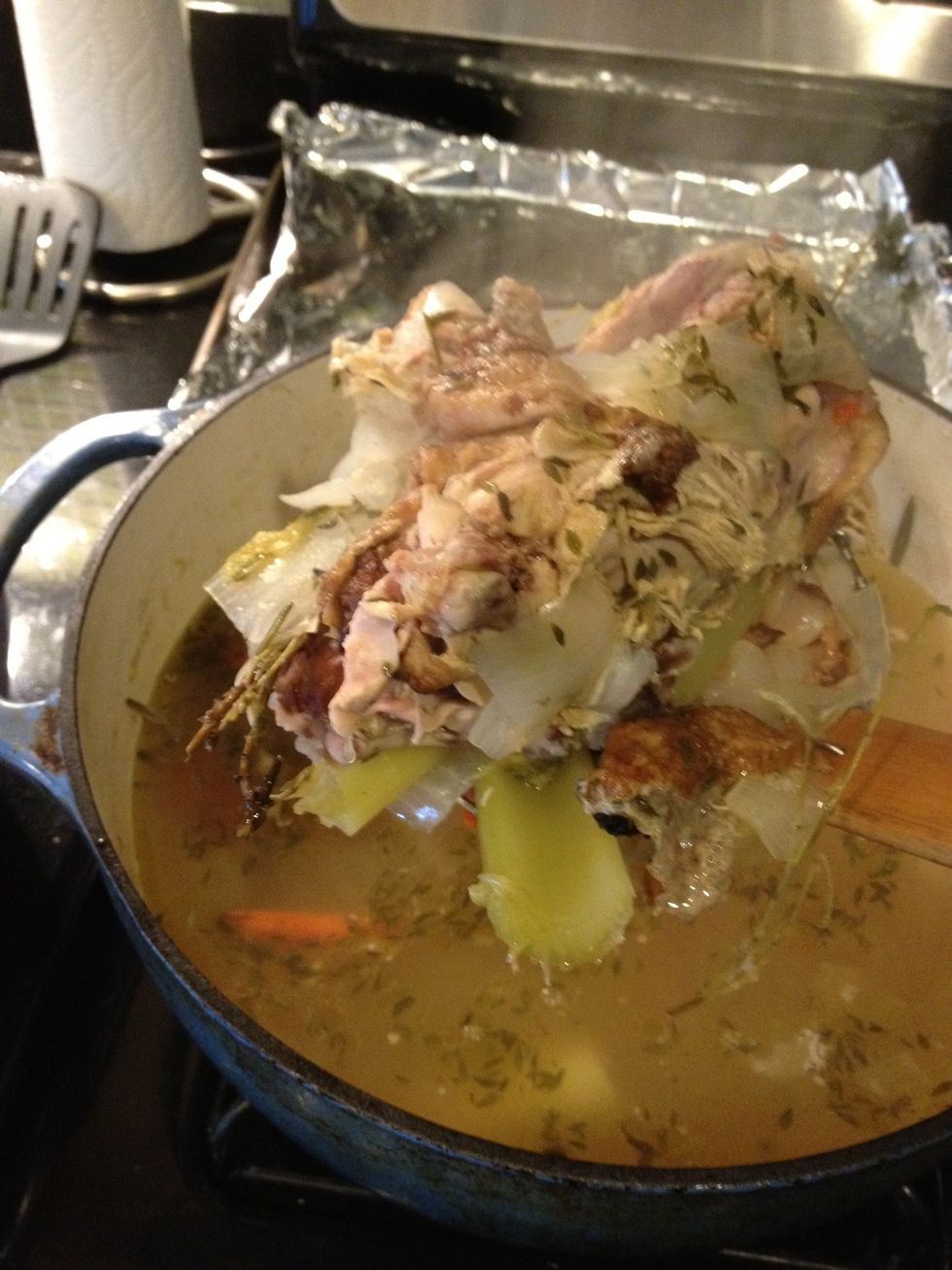 After at least an hour strain out chicken, bones, herbs and veggies.