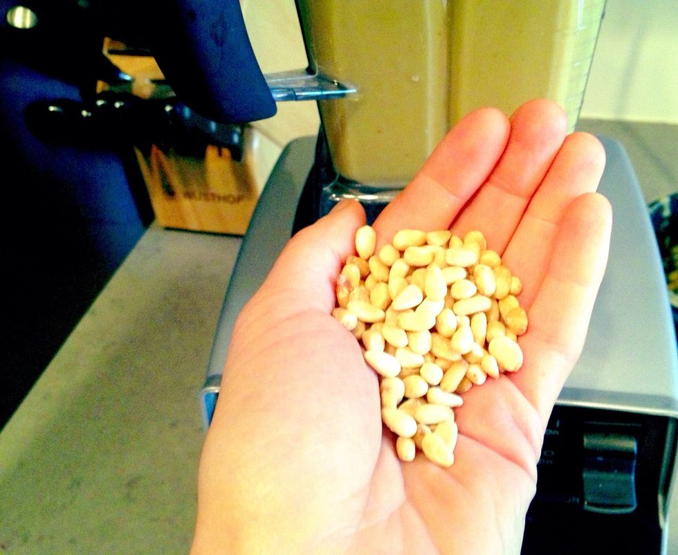 After blending for about a minute add the pine nuts and blend until smooth. That looks like 2 tablespoons, right??? I dont measure anything... Now is the time to add spices if you didn't yet.