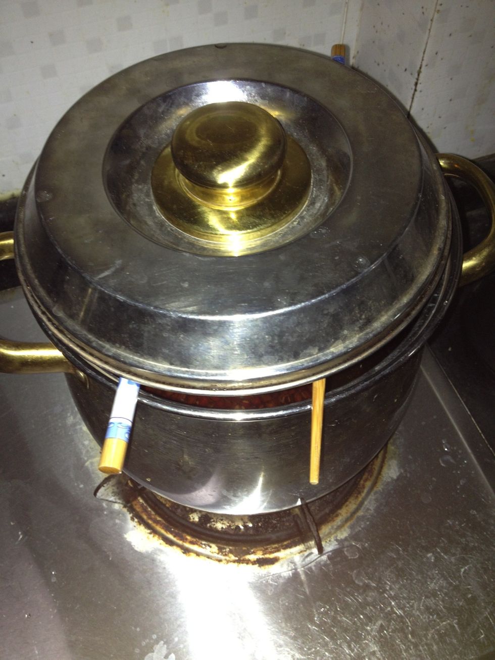 After boiled , turn the fire to middle and leave the pot of water boiled softly for about 45 minutes,and the pot should be half covered with lid to let the steam out.