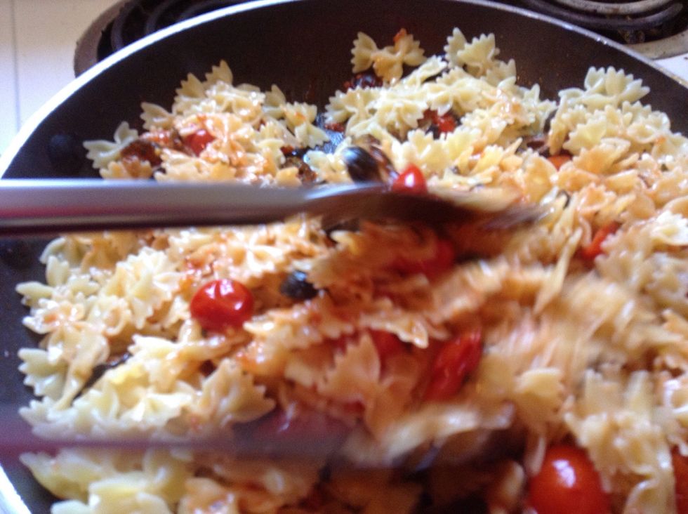 After boiling pasta until al dente, add to sauce and mix in