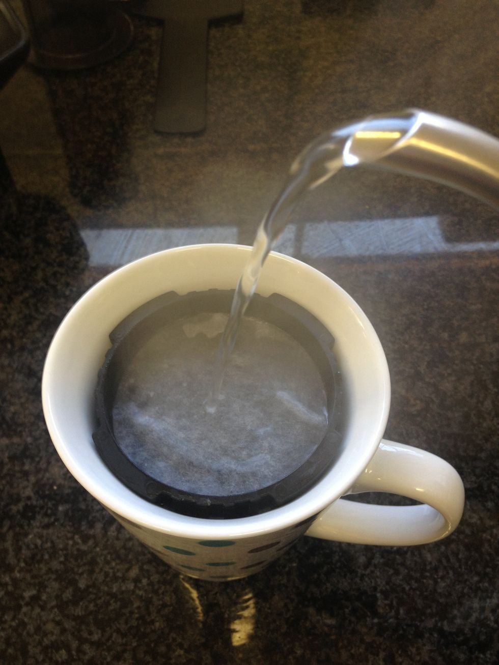 After boiling the water, use some of it to rinse the paper filter. This takes away the paper taste and assists the press. I do this step over my mug so that it warms at the same time.