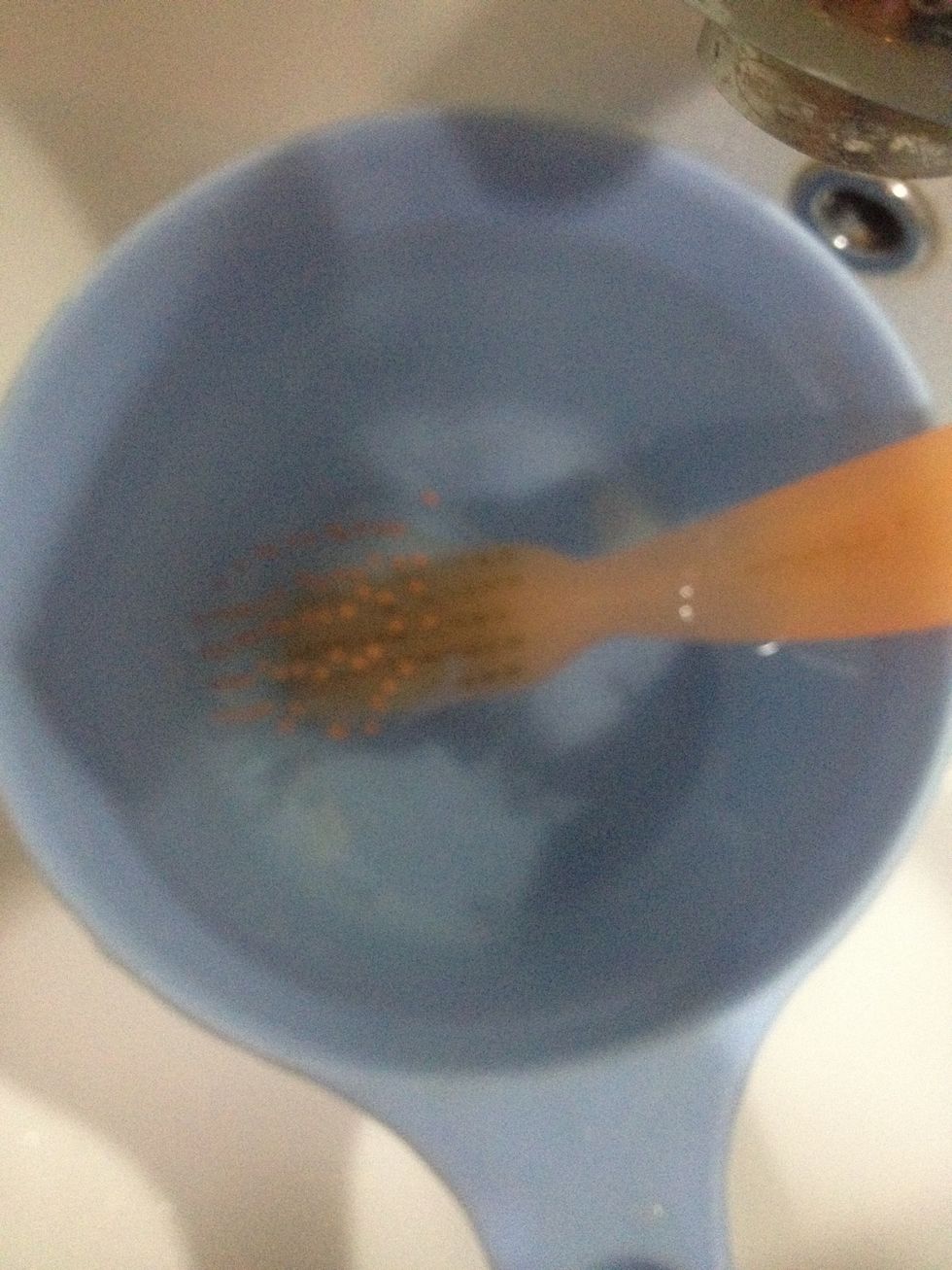 After brushing the dirt out, wash it with water. Replace the old water with new water, and put your brush back in (make sure it is not dirty anymore). You may put a pinch of shampoo in it if u want.