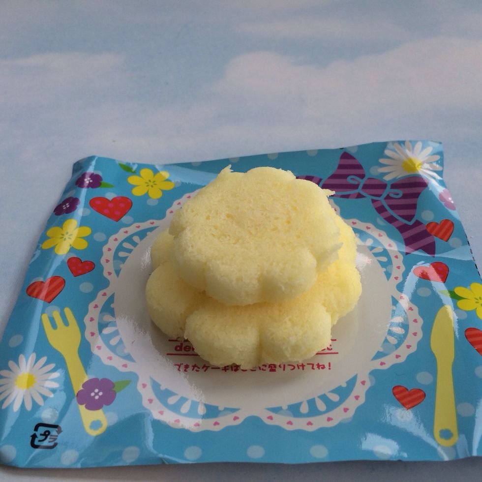 After Cake is Cooled, Remove from Tray VERY Carefully! May need knife to loosen around edges-Place LARGE Cake as Base on Bottom-Place Smaller Cake in top as Top Tier of 2 Layer Cake