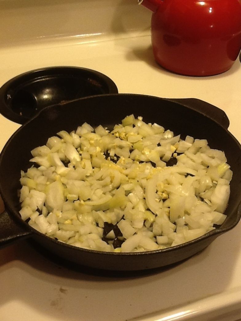 https://guides.brit.co/media-library/after-chopping-saut-u00e9-both-the-onion-and-garlic-in-a-saut-u00e9-pan-for-about-10-to-15-until-they-are-transluncent.jpg?id=23714182&width=784&quality=80