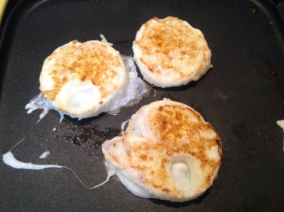 After cooking the eggs for about 2-3 minutes it's time to flip them. Note: if you are using egg fry rings you'll need to remove the eggs from the mold before flipping them.
