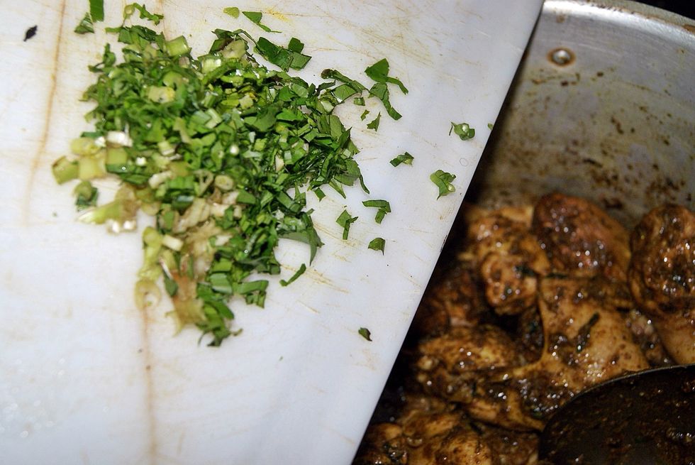 After cooking the meat for about 3 or 4 mins add the other half of the shadon beni and mix that about.